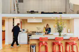 Space Theory designed the kitchen, which cost $50,000, with Carrara marble countertops and a built-in coffee bar; Dornbracht faucets and Dirk van der Kooij stools complete the space.