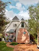 In the Oakland, California, home of Diana Blanco Taylor and Joshua Taylor, architect Sky Lanigan bumped out a garage to make a shingle-clad primary suite. An open living, dining, and kitchen area with tile accents is where, Diana says, the family spends the most time together.
