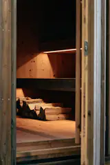 About a quarter of the unit is reserved for a wood-fired sauna with a separate entry.