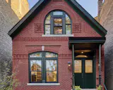 “These clients really wanted it to be as dead accurate as it could be,” architect Jordan Snittjer says of this Chicago town house’s masonry, which transitions to an overhauled interior and a glassy rear extension.
