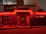 The exterior of Café Tondo makes an impression with its bright-red neon lights. 