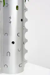 Saltik’s laser-cut aluminum Postmark vases have scalloped edges inspired by postage stamps.