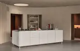 Vipp’s anodized aluminum V3 kitchen sits below a skylight.