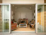 Cunningham’s clients sought a true indoor/outdoor space so he installed two sets of glass doors from Gamco that the family can swing wide open.
