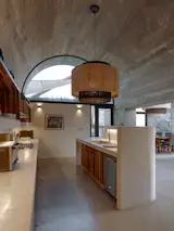 The kitchen and utility areas are located in the