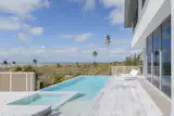The deck and pool off the living area are extremely exposed to the setting.