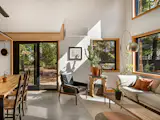 The ADU is located on a half-acre lot behind a 100-year-old duplex, which Chelsea bought and moved into in 2016. While the house had character, it felt cramped because of its small rooms and Chelsea craved a more open, airy space. To that end, she created as much connection between the ADU’s interior and the neighborhood. Windows and doors by Andersen and skylights by Velux keep the ADU bathed in natural light. “In summertime, it feels like you’re outside because you've got the sunlight from the skylights and the breeze coming through the windows,” Chelsea says.