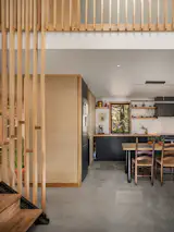 “I was trying to simplify everything as much as possible, but still keep things interesting,” Chelsea says of her approach to architectural embellishment. Vertical pine boards around the stair, the upstairs guardrail, and sleeping loft serve practical purposes and become a striking detail, too.
