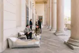The loggia outside Palazzina Appiani was littered with silver recliners and ottomans.