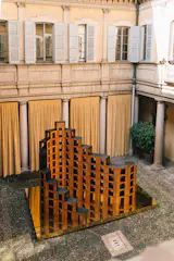 Upon entering Palazzo Acerbi, guests were first greeted by a wall of stools on a brass base. Intelligent staging by Studio Boum highlighted the calculations behind the angular furniture.