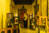 Stepping into the main passage, mirrored plinths elevated the wooden furniture further. Again, impressive layouts carried the forms, but the design was substantial enough to offer a nice contrast with the Baroque interiors.