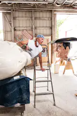 "Zack, the Phillips 66 Cowboy," of Giants Garage in Hot Springs, Arkansas, being refurbished in Mark Cline’s studio in Natural Bridge, Virginia.
