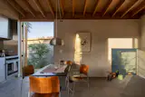 Logan and Gustavo chose materials they could leave exposed, like concrete for the floor and pine for the roof structure, as an aesthetic choice and to minimize expenses.