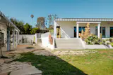 The property is planted with peach, pear, and olive trees.