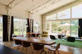 The home is built around structural steel trusses and a custom-adapted prefabricated system.