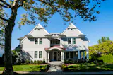 Twin gables and a curved portico welcome visitors to this stately New Jersey home. Monetti's coastal homes, he says, are 