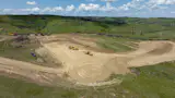 Mast Reforestation excavates a site for log burial.