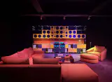 Cult-favorite modular furniture manufacturer USM partnered with audio-oriented furniture brand Symbol to introduce the USM Haller Soft Panel system in a moody, 1970s-inspired hi-fi listening lounge installation built around the Symbol speaker and living room collections.