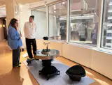 New York design studio Ollin, run by Noel Hernandez (pictured) and Viktoria Barbo, showed their Tlaloc table with a volcanic stone base and steel top with a polished mirror surface. The circular top has a customizable central insert. I particularly loved the sculptural, low-slung stools with cow hide cushions.  Photo 8 of 13 in Glass-Like Dimmer Knobs I Had to Touch and More Engaging Objects at the Afternoon Light Design Fair