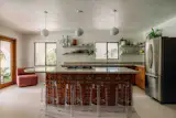 The 300-square-foot kitchen has a cook island, built-in oven, and stainless steel appliances.