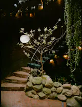 The open-air foyer of the Whale House leads in three directions: to the left, the sauna and pool; straight ahead, inside the home; and to the right, a stair that spirals upward.