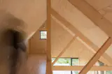 Above the main living room is a lofted space that can fit a set of twin mattresses for overnight guests (or Raul’s growing family).