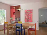 The dining room features colorful built-ins.