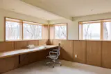 White oak wainscoting helps connect the office to the rest of the house. “We thought, we want to have a space where, if you’re going to be working, it’s actually a lovely place to be versus an afterthought,” Tara says.