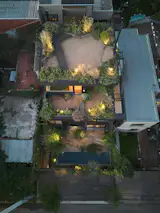 Built on a compact lot near the Río de la Plata, Ángel Jorge’s 1,992-square-foot, three-story house maximizes outdoor space through a series of planted terraces and patios distributed across three different levels. Native grasses, trees and shrubs attract local birds and insects.