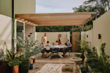 The rear courtyard is a favorite space for family gatherings with Luke’s mom, Marnie.