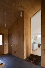The entry has an open feel, with no doors into the living space or the garage area.