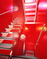The bright red staircase in the Big House, photographed for Dwell.