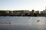 Swimmers lounge on a dock on the Willamette River in Portland, Oregon.