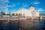 People swim against the ban on swimming in the Spree in front of the Humboldt Forum in Berlin, Germany, in August 2025. 