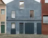Burnished Aluminum Sheeting Covers the Entire Ground Floor of This Renovated 1893 Lisbon Home