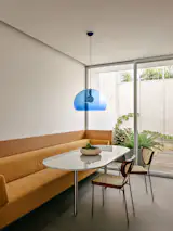 A breakfast banquette in the kitchen connects with the garden.
