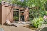 A series of bluestone patios, courtyards, and terraces creates several outdoor sitting areas around the house, while the landscaped grounds include a koi pond, Pennsylvania fieldstone walkways, and a pergola-topped deck.