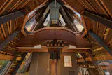 Cathedral-like ceilings rise above the living room.