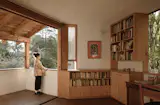 The spacious balcony on the second floor has the best views in the house: it overlooks the surrounding gardens and the Cerro de San Cristóbal, a wooded hill and nature preserve that rises behind the property. “Between 8 in the morning and 4 p.m., these sliding doors remain open and it’s super comfortable,” says Constantino. “When the mosquitos arrive, we close them and open the smaller screened windows.”
