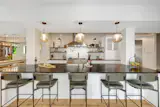 The kitchen has soapstone counters, two dishwashers, and a beverage fridge.&nbsp;&nbsp;