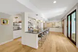 The large kitchen sits between two dining areas, and it includes a pantry.&nbsp; &nbsp;