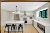 The one-bedroom carriage house has its own kitchen, bath, and laundry, allowing it to function separately from the main house.&nbsp;&nbsp;