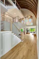 Openings make the upper floors feel like part of the ground-floor living area.&nbsp;