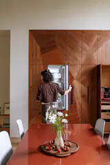 <span style="font-family: Theinhardt, -apple-system, BlinkMacSystemFont, "Segoe UI", Roboto, Oxygen-Sans, Ubuntu, Cantarell, "Helvetica Neue", sans-serif;">Tim Peters of <a href="http://treehousehardwoods.com">Treehouse</a> </span><span style="font-family: Theinhardt, -apple-system, BlinkMacSystemFont, "Segoe UI", Roboto, Oxygen-Sans, Ubuntu, Cantarell, "Helvetica Neue", sans-serif;">CNC-milled the pieces for Ally</span><span style="font-family: Theinhardt, -apple-system, BlinkMacSystemFont, "Segoe UI", Roboto, Oxygen-Sans, Ubuntu, Cantarell, "Helvetica Neue", sans-serif;">’</span><span style="font-family: Theinhardt, -apple-system, BlinkMacSystemFont, "Segoe UI", Roboto, Oxygen-Sans, Ubuntu, Cantarell, "Helvetica Neue", sans-serif;">s mosaic cabinet fronts. The </span><span style="font-family: Theinhardt, -apple-system, BlinkMacSystemFont, "Segoe UI", Roboto, Oxygen-Sans, Ubuntu, Cantarell, "Helvetica Neue", sans-serif;">French Door Refrigerator Freezer is from <a href="http://fisherpaykel.com">Fisher & Paykel</a>. </span><span style="font-family: Theinhardt, -apple-system, BlinkMacSystemFont, "Segoe UI", Roboto, Oxygen-Sans, Ubuntu, Cantarell, "Helvetica Neue", sans-serif;">The walls were painted in Lime Wash Paint 107 from <a href="http://jhwallpaints.com">JH Wall Paints</a>. </span><span style="font-family: Theinhardt, -apple-system, BlinkMacSystemFont, "Segoe UI", Roboto, Oxygen-Sans, Ubuntu, Cantarell, "Helvetica Neue", sans-serif;">The Strut dining table is from <a href="http://bludot.com">Blu Dot</a>.</span>