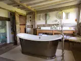 Two additional bedrooms and another bathroom are located on the second floor.