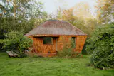 A 10-Person Sauna Somehow Fits in This Tiny Summer House in Denmark—and Converts Into a Bedroom