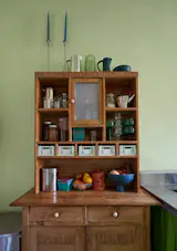“My friends and family were laughing when I bought the big antique dish hutch for my kitchen, but I’ve come around to the way it balances with newer items,” Catherine says. “There’s more texture and depth.”