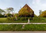 Her Multifamily Detroit Home Is Part Design Studio, Part Neighborhood Gathering Spot