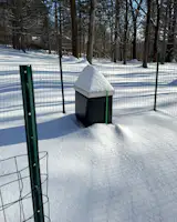 The beehive sustained some serious winter snow. 