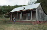 Dolly Parton Never Left Her Childhood Home Behind. We Shouldn’t Either